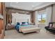 Luxurious main bedroom with a plush bed and marble accent wall at 15620 Panther Lake Dr, Winter Garden, FL 34787