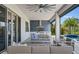 Outdoor kitchen with stainless steel appliances and seating area at 15620 Panther Lake Dr, Winter Garden, FL 34787