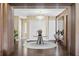 Elegant entryway with modern chandelier and wood floors at 15620 Panther Lake Dr, Winter Garden, FL 34787