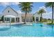 Community pool with a water feature and lounge chairs at 15620 Panther Lake Dr, Winter Garden, FL 34787