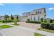 Two-story house with a three car garage and landscaping at 15620 Panther Lake Dr, Winter Garden, FL 34787