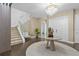 Elegant entryway showcasing a grand staircase and contemporary design at 15620 Panther Lake Dr, Winter Garden, FL 34787