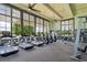 Modern fitness center with various equipment and large windows at 15620 Panther Lake Dr, Winter Garden, FL 34787