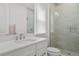 Modern bathroom with a walk-in shower and white cabinets at 15620 Panther Lake Dr, Winter Garden, FL 34787