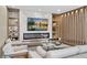 Living room features a modern fireplace and built-in shelving units at 15620 Panther Lake Dr, Winter Garden, FL 34787