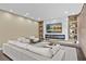 Living room boasts a marble fireplace, built-in shelving, and a large TV at 15620 Panther Lake Dr, Winter Garden, FL 34787