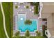 Overhead view of a community pool with surrounding lounge chairs at 15620 Panther Lake Dr, Winter Garden, FL 34787