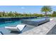 Modern pool with a spa and waterfall features at 15620 Panther Lake Dr, Winter Garden, FL 34787