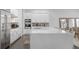 Bright kitchen featuring white cabinets and a large island at 15620 Panther Lake Dr, Winter Garden, FL 34787