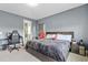 Bedroom with a king-size bed, a desk, and en-suite bathroom at 15620 Panther Lake Dr, Winter Garden, FL 34787