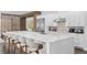 Modern kitchen with large island and white cabinetry at 15620 Panther Lake Dr, Winter Garden, FL 34787