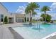 Community pool with a water feature and lounge chairs at 15620 Panther Lake Dr, Winter Garden, FL 34787