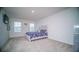 Bedroom with floral bedding and a gray headboard at 2378 White Lilly Dr, Kissimmee, FL 34747