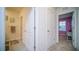 Hallway with doors to bedrooms and bathroom at 2378 White Lilly Dr, Kissimmee, FL 34747