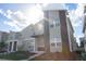 Modern two-story townhome with stone accents at 1038 Splash Shot Pl, Davenport, FL 33896