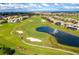 Aerial view of golf course and community at 1038 Splash Shot Pl, Davenport, FL 33896