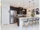Modern kitchen with stainless steel appliances and an island at 1038 Splash Shot Pl, Davenport, FL 33896