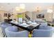 Modern dining room with a large table and seating for six at 1038 Splash Shot Pl, Davenport, FL 33896
