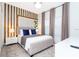 Bright bedroom with a comfortable king-size bed and wood accent wall at 1038 Splash Shot Pl, Davenport, FL 33896