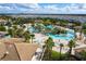 Large community pool with surrounding houses at 1038 Splash Shot Pl, Davenport, FL 33896