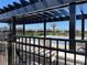 Community pool with pergola, benches, and fenced area at 4520 Gliding Wave St, Winter Garden, FL 34787