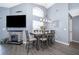 Dining area with a six-seat table and gray walls at 104 Langham Dr, Davenport, FL 33897