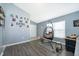 Living room with hanging chair and view into the dining area at 104 Langham Dr, Davenport, FL 33897
