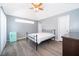 Bedroom with ceiling fan and view of backyard at 104 Langham Dr, Davenport, FL 33897