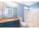 Bathroom with granite vanity and shower at 104 Langham Dr, Davenport, FL 33897