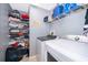 Laundry room with washer, dryer, and ample shelving at 104 Langham Dr, Davenport, FL 33897