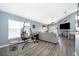 Spacious living room with gray sectional sofa and a fireplace at 104 Langham Dr, Davenport, FL 33897