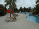 Community pool with people enjoying inner tubes at 5265 Oakbourne Ave, Davenport, FL 33837