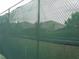 Chain link fence surrounding tennis courts, offering privacy at 5265 Oakbourne Ave, Davenport, FL 33837
