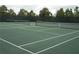 Two tennis courts with nets and white line markings at 5265 Oakbourne Ave, Davenport, FL 33837