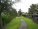 Curving path ideal for walking, surrounded by lush greenery at 5265 Oakbourne Ave, Davenport, FL 33837