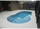 Refreshing kidney-shaped pool with a safety rail at 5265 Oakbourne Ave, Davenport, FL 33837