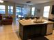 Open concept kitchen and living room with island and seating at 5265 Oakbourne Ave, Davenport, FL 33837