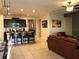 Open concept kitchen and living area with island and seating at 5265 Oakbourne Ave, Davenport, FL 33837