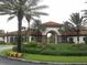 Attractive community entrance with landscaping and gated entry at 5265 Oakbourne Ave, Davenport, FL 33837