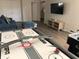 Finished basement with air hockey, foosball, and comfortable seating at 5265 Oakbourne Ave, Davenport, FL 33837