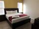 King-size bed, ample closet space, and large windows in a bright bedroom at 5265 Oakbourne Ave, Davenport, FL 33837
