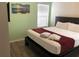 King-size bed, window with blinds, and neutral wall colors at 5265 Oakbourne Ave, Davenport, FL 33837