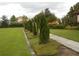 Landscaped walkway with neatly planted trees and green grass at 5265 Oakbourne Ave, Davenport, FL 33837