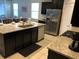 Modern kitchen with granite countertops and a large island at 5265 Oakbourne Ave, Davenport, FL 33837