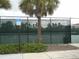 Well-maintained tennis courts with chain link fencing at 5265 Oakbourne Ave, Davenport, FL 33837