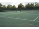 Two tennis courts with nets and white line markings at 5265 Oakbourne Ave, Davenport, FL 33837