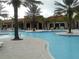 Large community pool with plenty of lounge chairs at 5265 Oakbourne Ave, Davenport, FL 33837