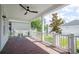 Brick paved porch with white railings and ceiling fan at 1862 Beach Ridge Rd, Celebration, FL 34747