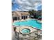 Aerial view of community pool, spa, and surrounding area at 3100 Parkway Blvd # 712, Kissimmee, FL 34747