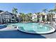 Resort-style pool with surrounding patio furniture at 3100 Parkway Blvd # 712, Kissimmee, FL 34747